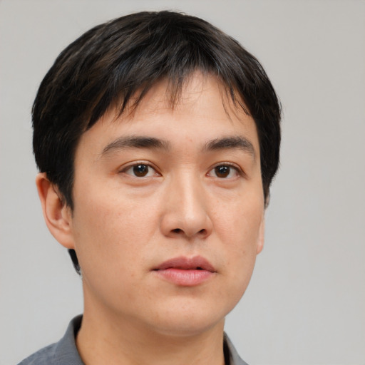 Neutral asian young-adult male with short  brown hair and brown eyes