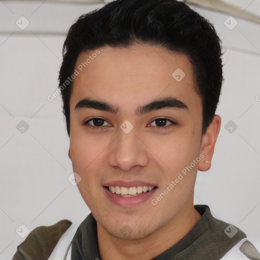 Joyful white young-adult male with short  black hair and brown eyes