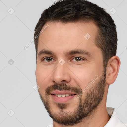 Joyful white young-adult male with short  brown hair and brown eyes