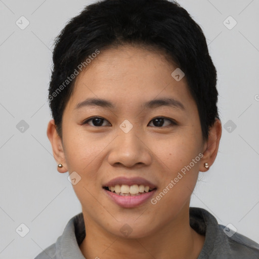 Joyful asian young-adult female with short  black hair and brown eyes