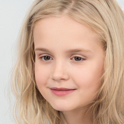 Joyful white child female with long  brown hair and brown eyes