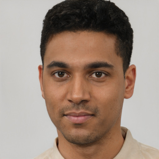 Neutral latino young-adult male with short  black hair and brown eyes