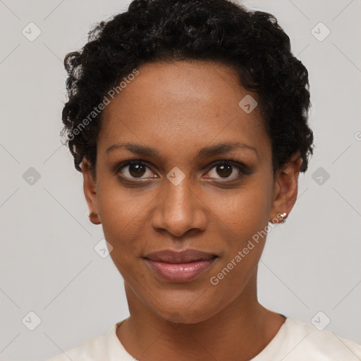 Joyful black young-adult female with short  black hair and brown eyes