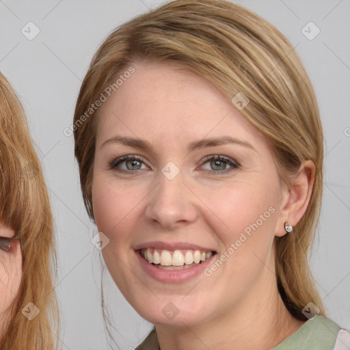 Joyful white young-adult female with medium  brown hair and blue eyes