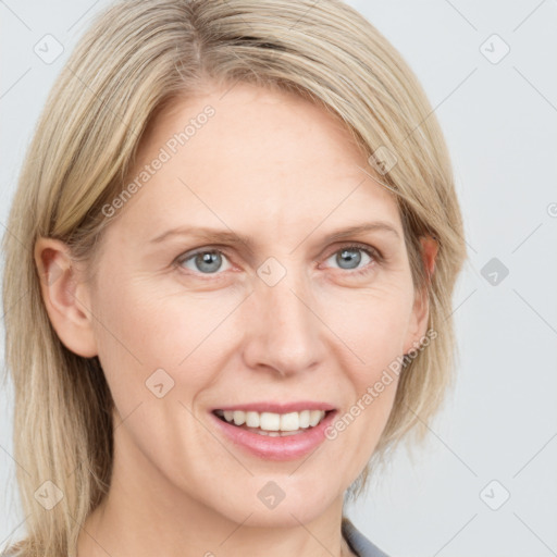 Joyful white adult female with medium  brown hair and blue eyes