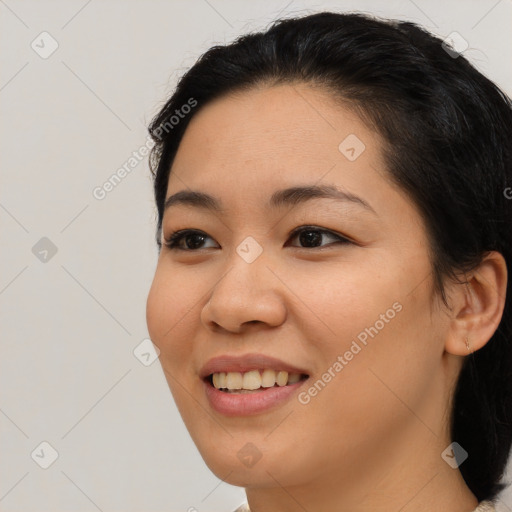 Joyful latino young-adult female with medium  brown hair and brown eyes