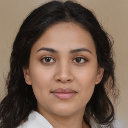 Joyful latino young-adult female with medium  brown hair and brown eyes