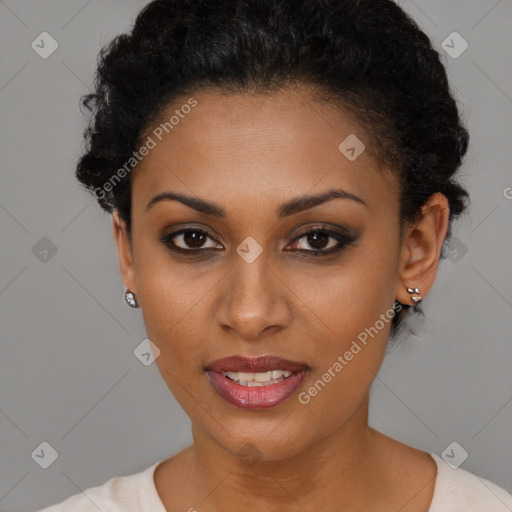 Joyful black young-adult female with short  black hair and brown eyes