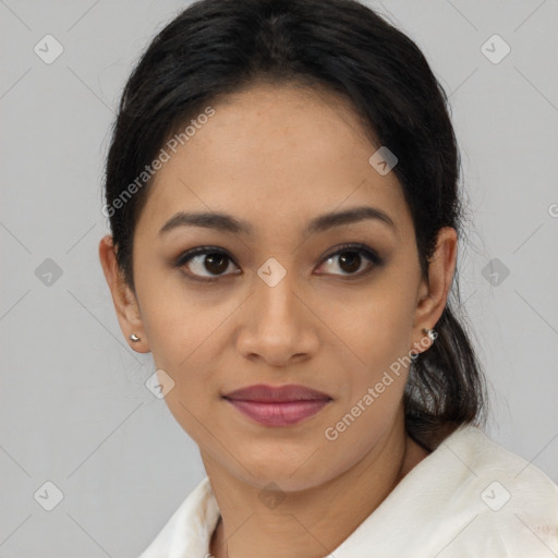 Joyful latino young-adult female with medium  brown hair and brown eyes