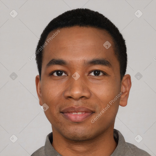 Joyful black young-adult male with short  black hair and brown eyes