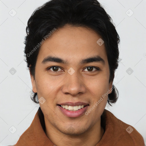 Joyful latino young-adult male with short  brown hair and brown eyes