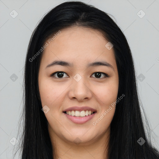 Joyful asian young-adult female with long  black hair and brown eyes