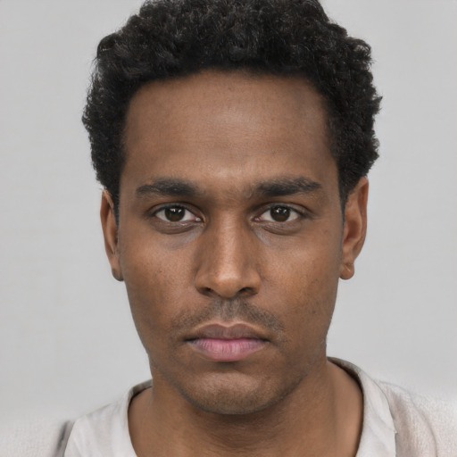 Neutral black young-adult male with short  black hair and brown eyes