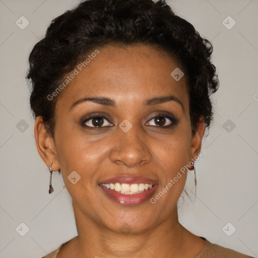 Joyful black adult female with short  brown hair and brown eyes