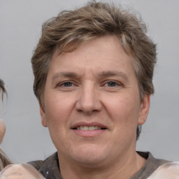 Joyful white adult male with short  brown hair and grey eyes