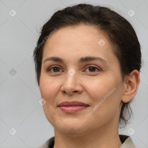 Joyful white adult female with medium  brown hair and brown eyes