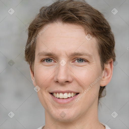 Joyful white adult female with short  brown hair and grey eyes