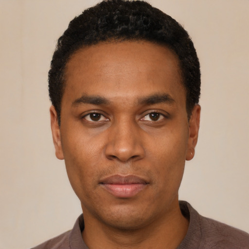 Neutral black young-adult male with short  black hair and brown eyes