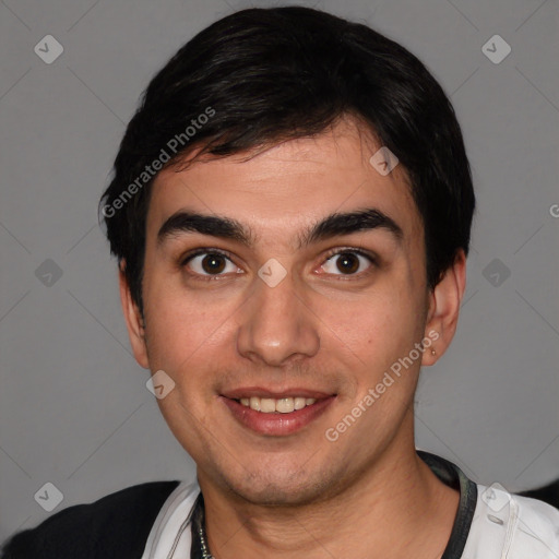 Joyful white young-adult male with short  black hair and brown eyes