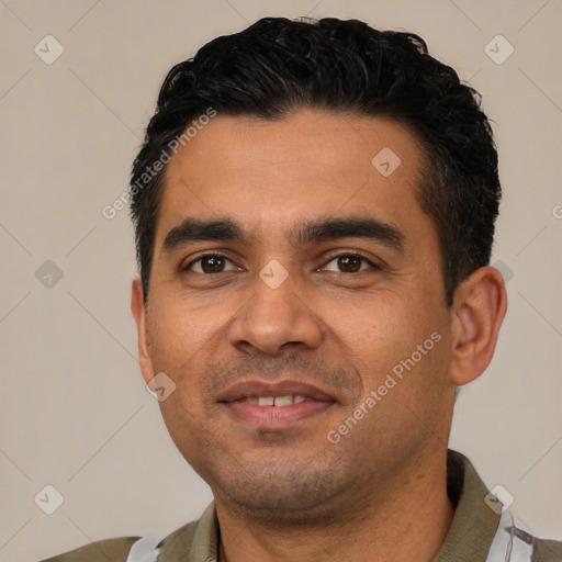 Joyful latino young-adult male with short  black hair and brown eyes