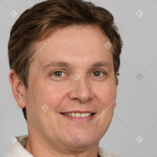 Joyful white adult male with short  brown hair and grey eyes