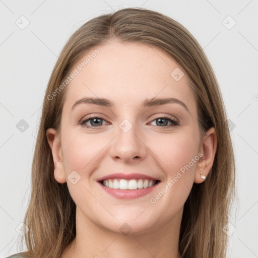 Joyful white young-adult female with long  brown hair and grey eyes