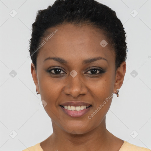 Joyful black young-adult female with short  black hair and brown eyes
