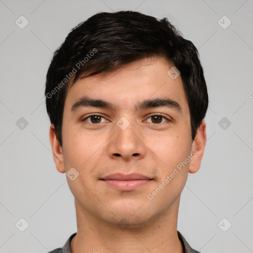 Joyful white young-adult male with short  black hair and brown eyes