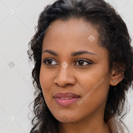 Joyful latino young-adult female with long  brown hair and brown eyes