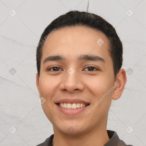 Joyful white young-adult male with short  black hair and brown eyes