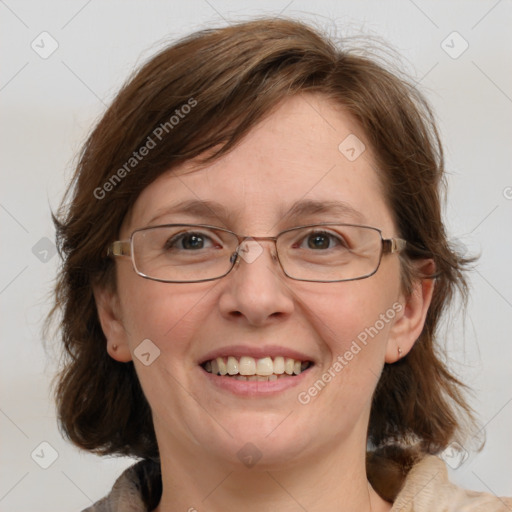 Joyful white adult female with medium  brown hair and blue eyes