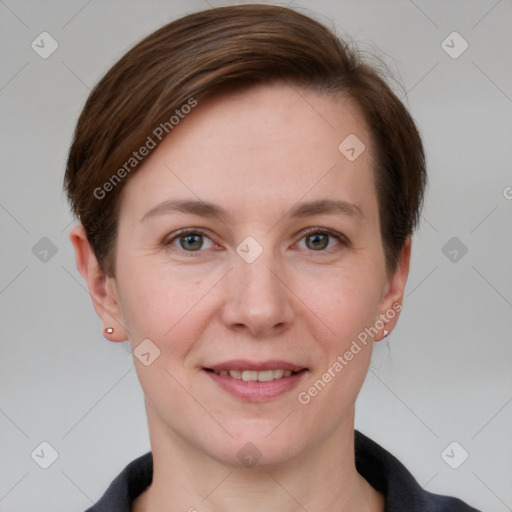 Joyful white young-adult female with short  brown hair and grey eyes