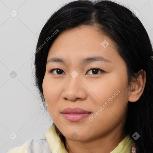 Joyful asian young-adult female with medium  black hair and brown eyes