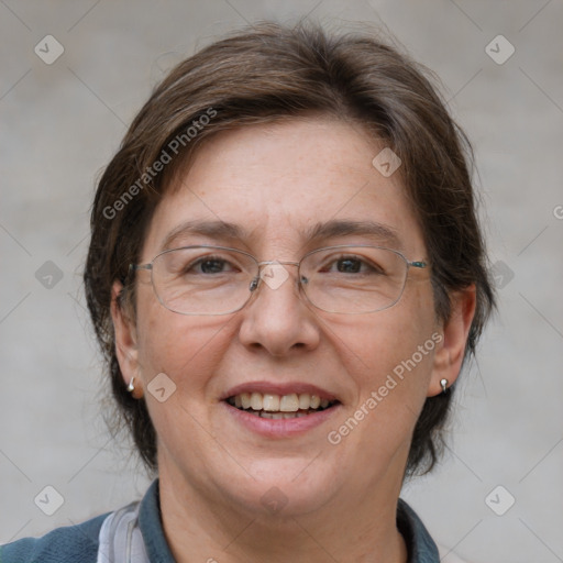 Joyful white adult female with medium  brown hair and blue eyes