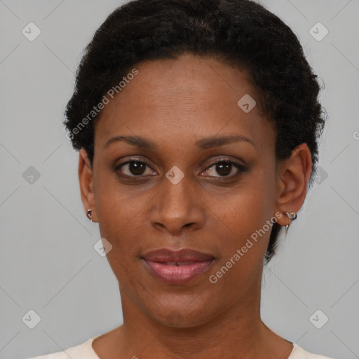 Joyful black young-adult female with short  brown hair and brown eyes