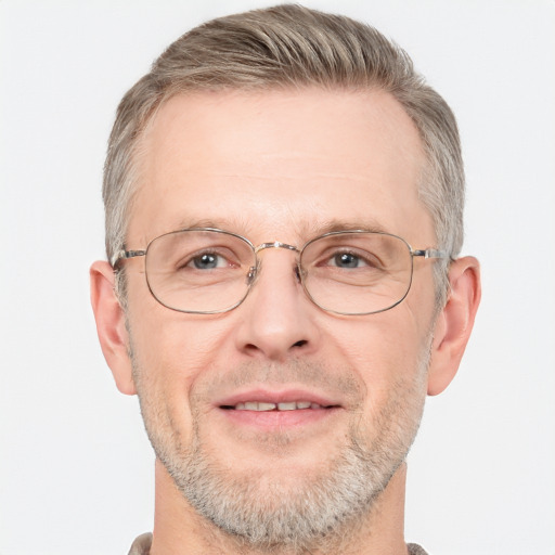 Joyful white middle-aged male with short  gray hair and grey eyes