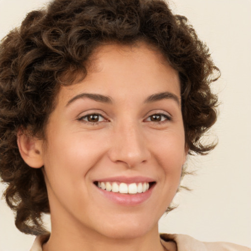 Joyful white young-adult female with medium  brown hair and brown eyes