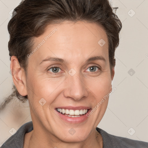 Joyful white adult female with short  brown hair and brown eyes