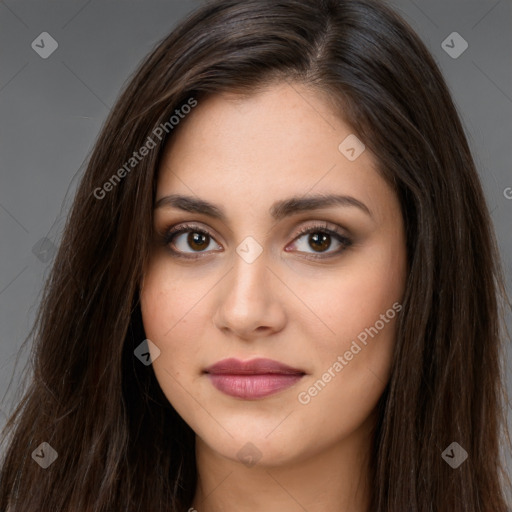 Joyful white young-adult female with long  brown hair and brown eyes