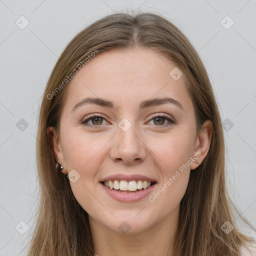 Joyful white young-adult female with long  brown hair and grey eyes