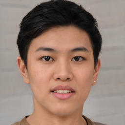 Joyful asian young-adult male with short  brown hair and brown eyes