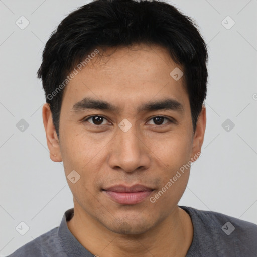 Joyful asian young-adult male with short  black hair and brown eyes