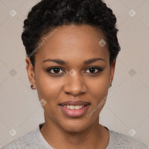 Joyful black young-adult female with short  black hair and brown eyes