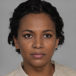 Neutral black young-adult female with short  brown hair and brown eyes