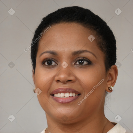 Joyful latino young-adult female with short  brown hair and brown eyes