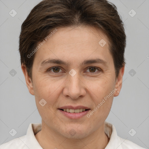 Joyful white adult female with short  brown hair and brown eyes