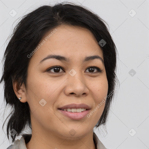 Joyful latino young-adult female with medium  brown hair and brown eyes