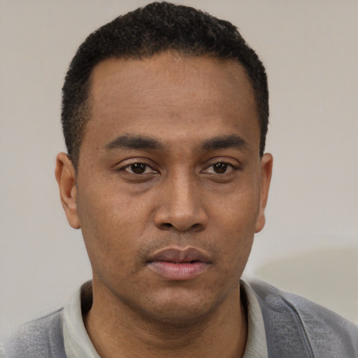 Neutral black young-adult male with short  black hair and brown eyes