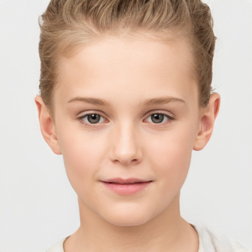 Joyful white child female with short  brown hair and brown eyes