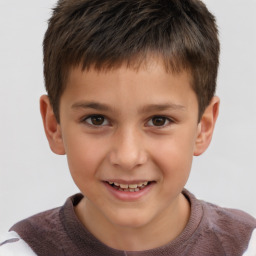 Joyful white child male with short  brown hair and brown eyes